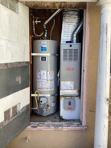 Bradford White water heater installation in residential utility area