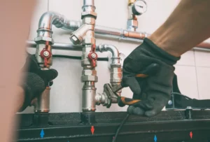 professional plumber detecting hidden water leak