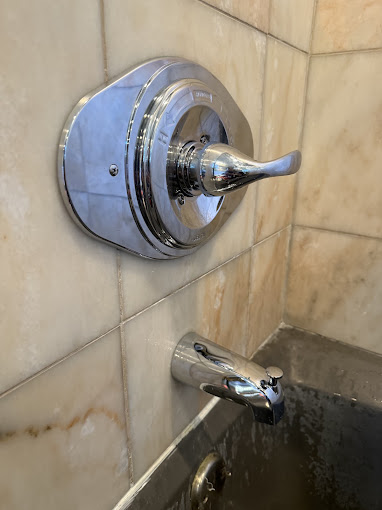 Shower valve and trim installed in a tiled shower