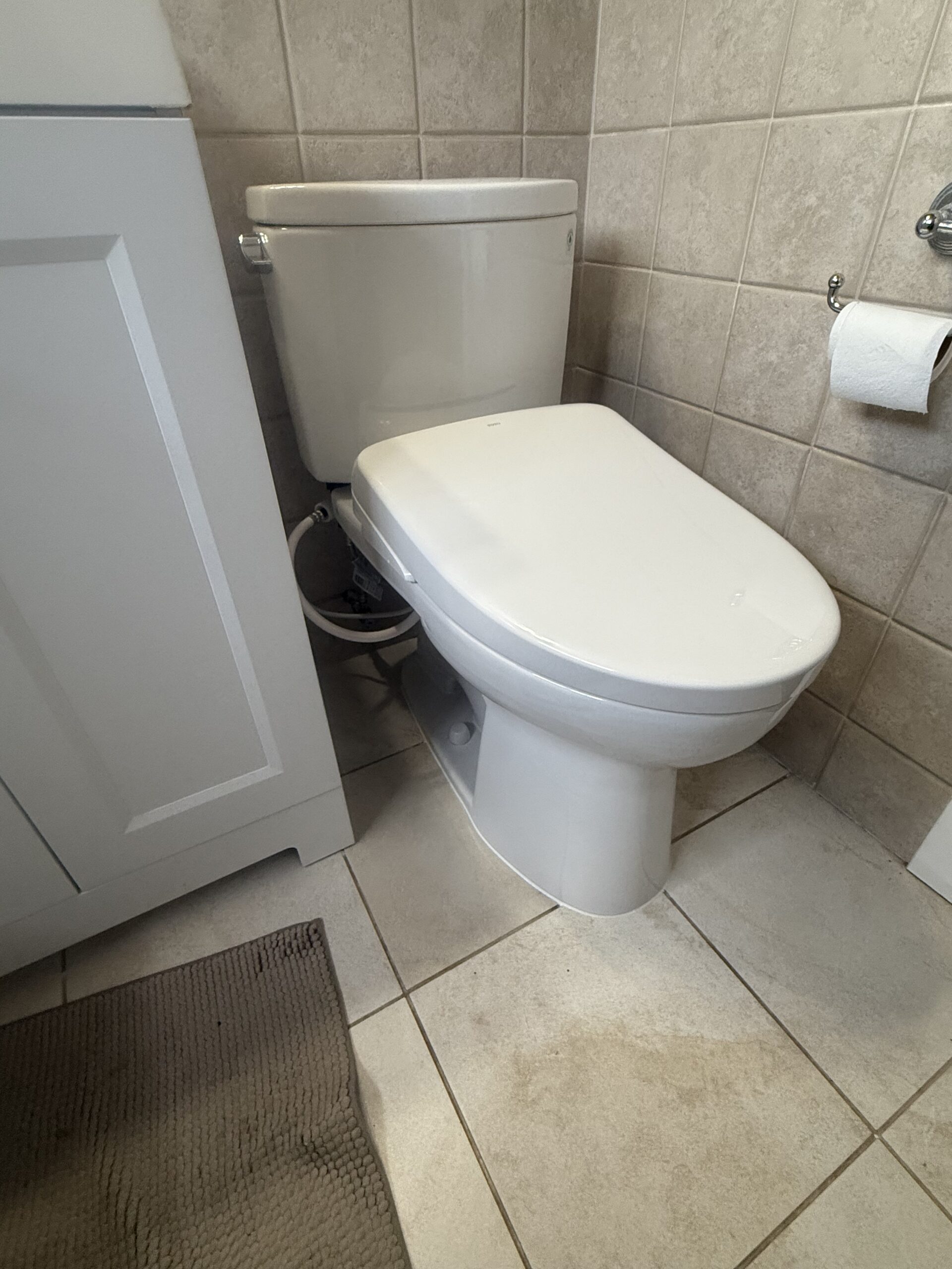 TOTO Drake with bidet installed in residential bathroom