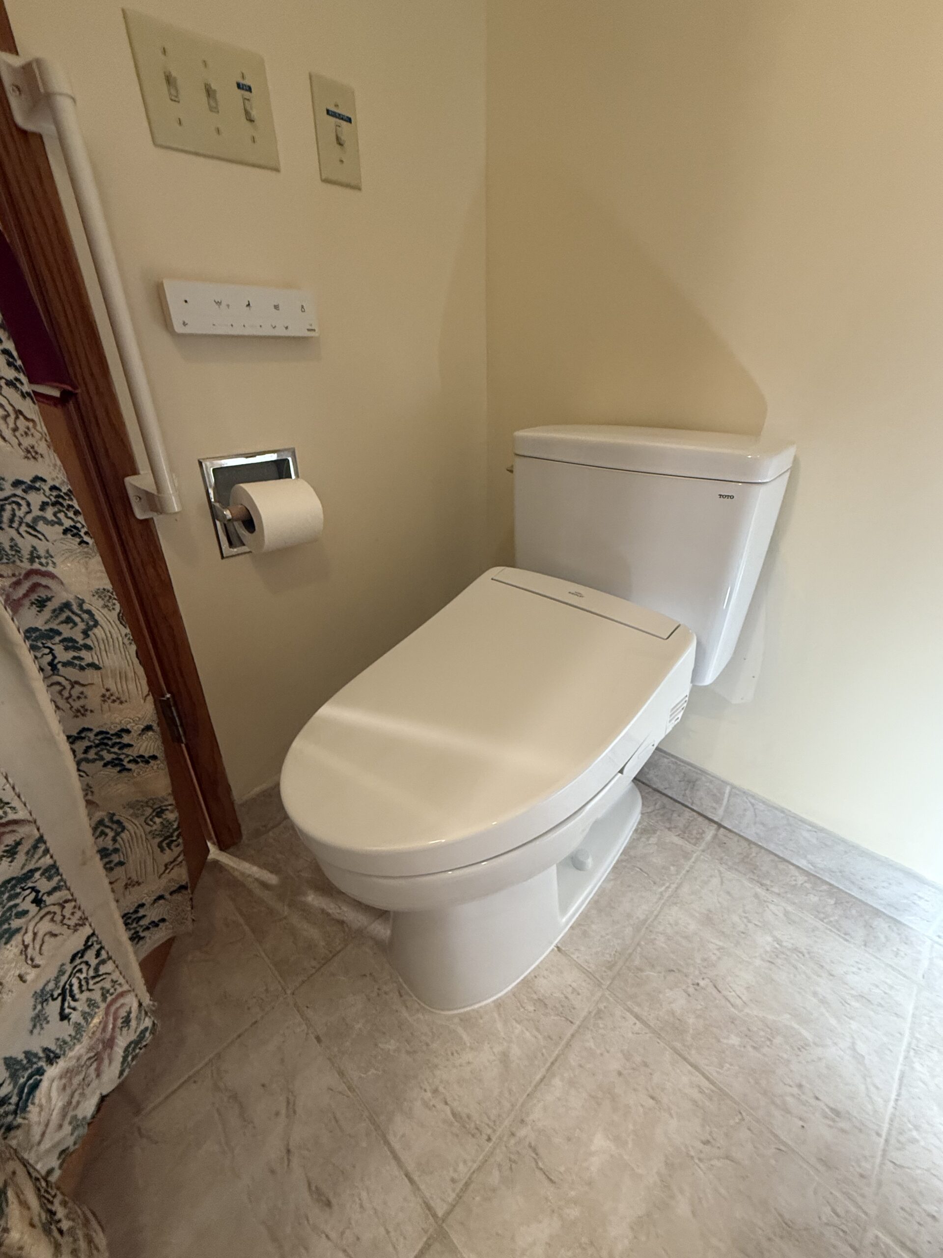 TOTO Drake toilet with washlet installed in residential bathroom