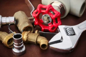 Plumber inspecting an older home in San Mateo Peninsula for hidden plumbing issues